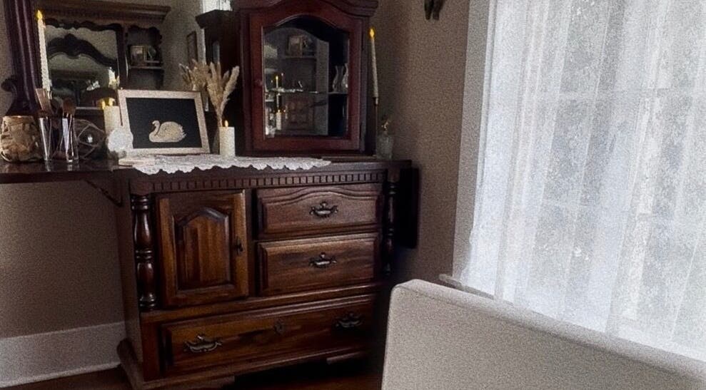 Elegant vintage dresser at Southern Siren Studio, Jacksonville, Florida, US, showcasing classic decor.