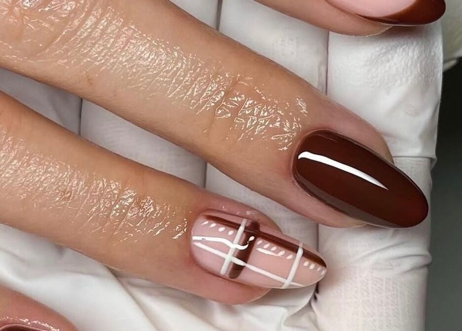 Stylish brown and plaid nail design at Mbm Nails, Hadleigh, England, GB showcasing elegance and artistry.