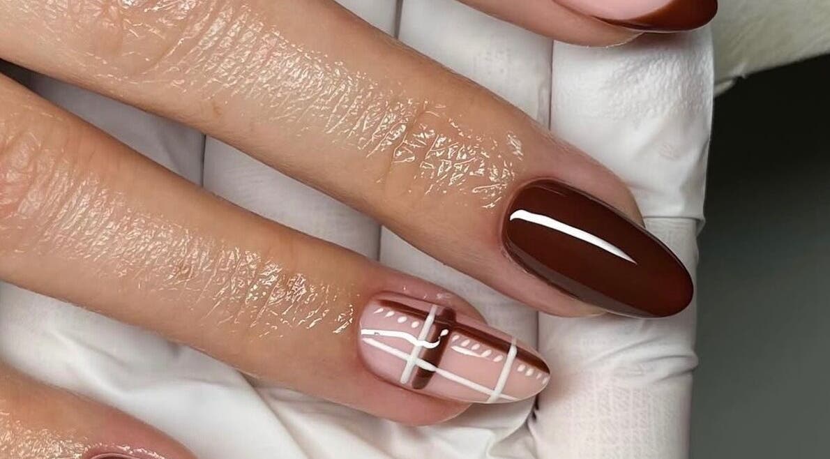 Stylish brown and plaid nail design at Mbm Nails, Hadleigh, England, GB showcasing elegance and artistry.