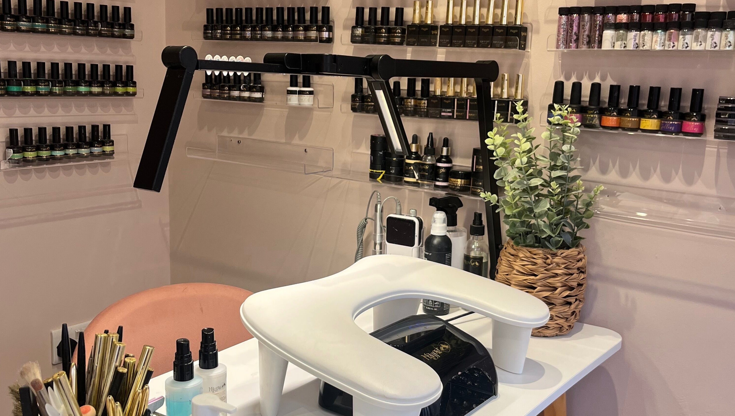 Nail station with polish at The Beauty Shed, West, England, GB, displaying a chic and inviting setup.