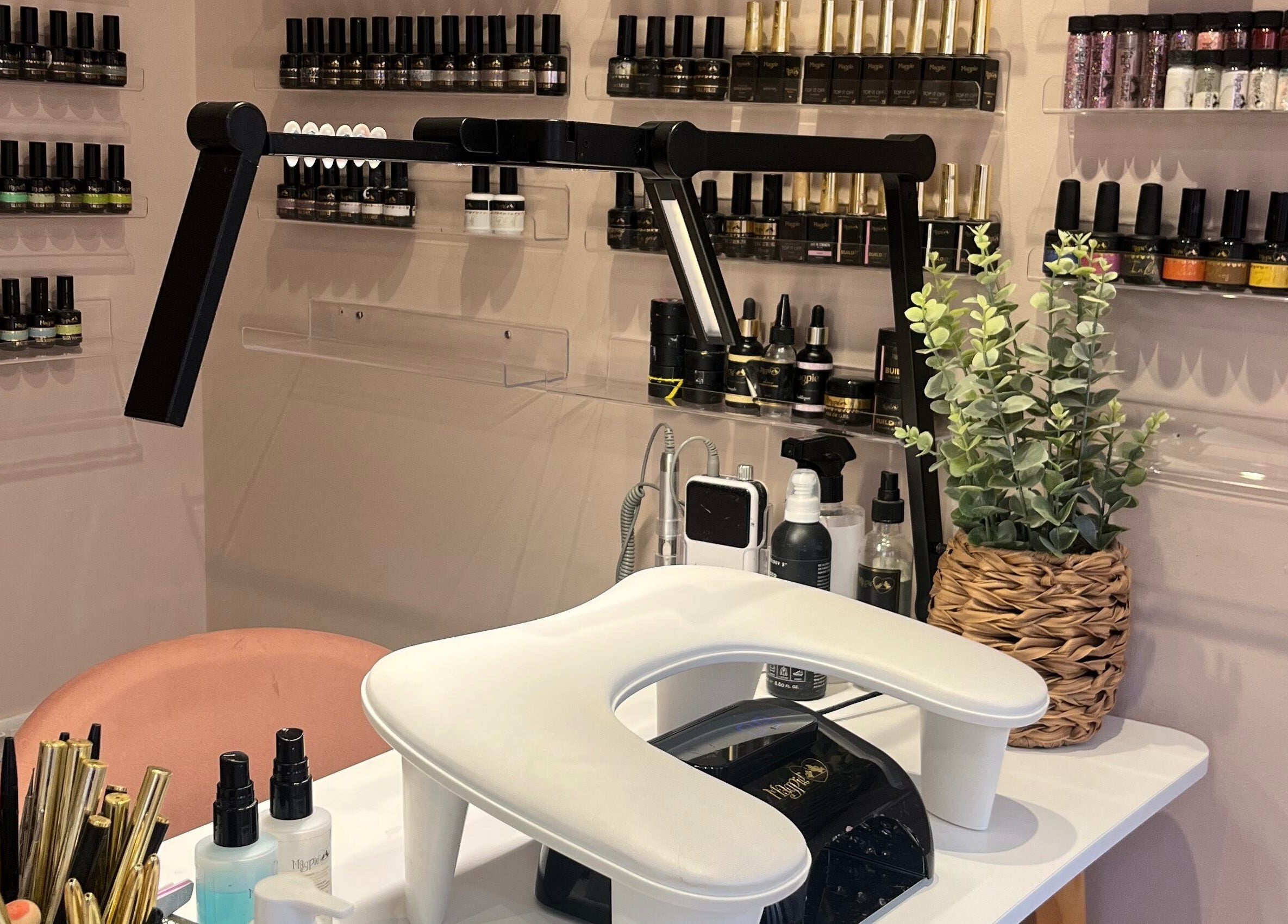 Nail station with polish at The Beauty Shed, West, England, GB, displaying a chic and inviting setup.
