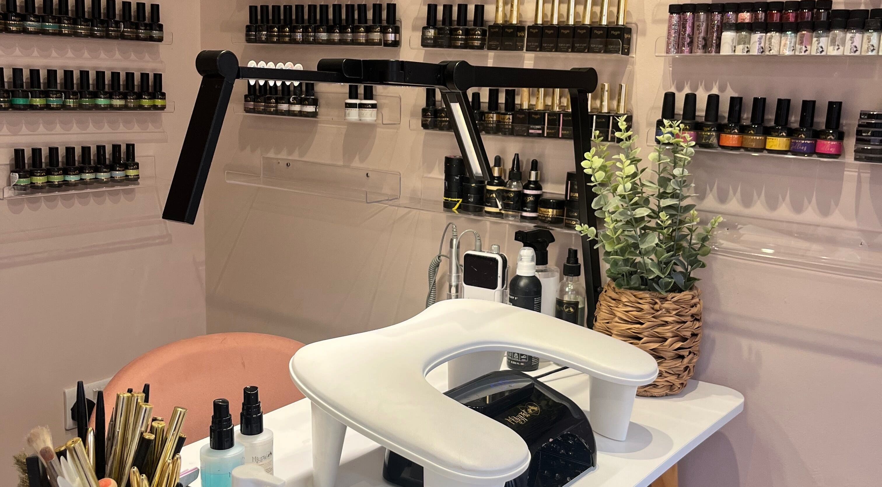 Nail station with polish at The Beauty Shed, West, England, GB, displaying a chic and inviting setup.