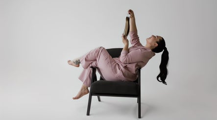 Person relaxing in salon chair, with hair extensions at Beauty Hair by Vicky, Dublin, County Dublin, IE.
