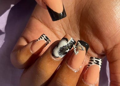 Exquisite nail art at Deluxee Nails By Abby, Draxhall, St. Ann Parish, JM, showcasing detailed designs.
