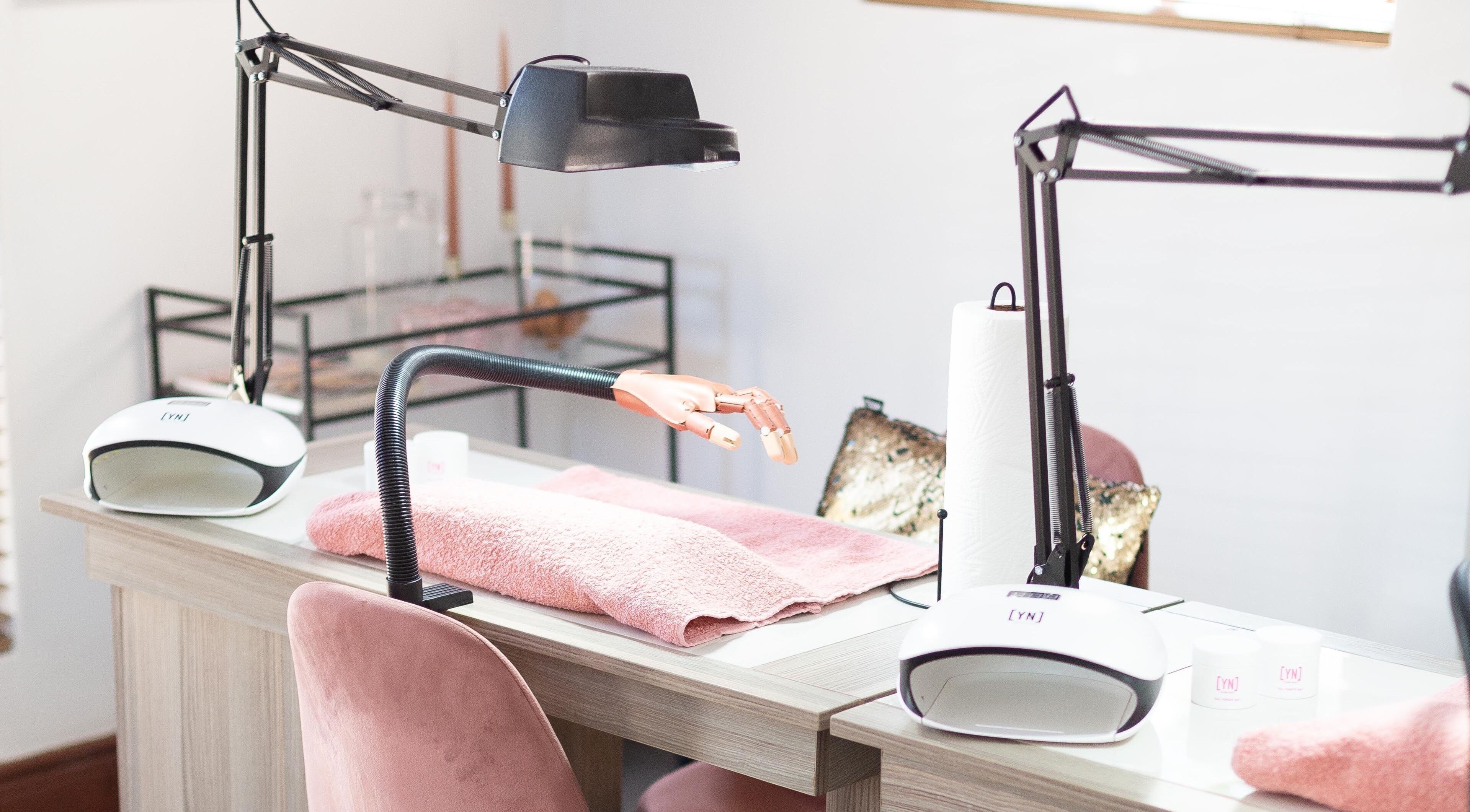 Modern nail station at Blush Nail Boutique, Pretoria, Gauteng, ZA featuring stylish equipment and pink accents.