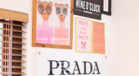 Art-covered wall at Blush Nail Boutique in Pretoria, Gauteng, ZA, featuring chic and playful decor.