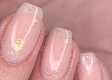 Close-up of pink nails with gold flecks at Blush Nail Boutique, Pretoria, Gauteng, ZA.