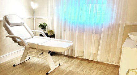 Relaxing treatment room at MEMA Skin & Wellness Clinic, Lytham, GB with a comfortable chair and soothing ambiance.