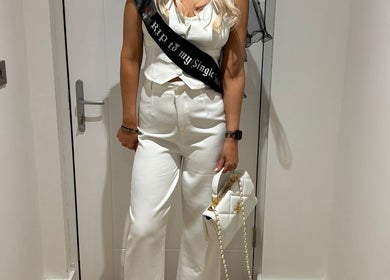 Woman in white outfit at JOAM Glow London Mobile Spray Tanning Sienna X, London, England, GB.
