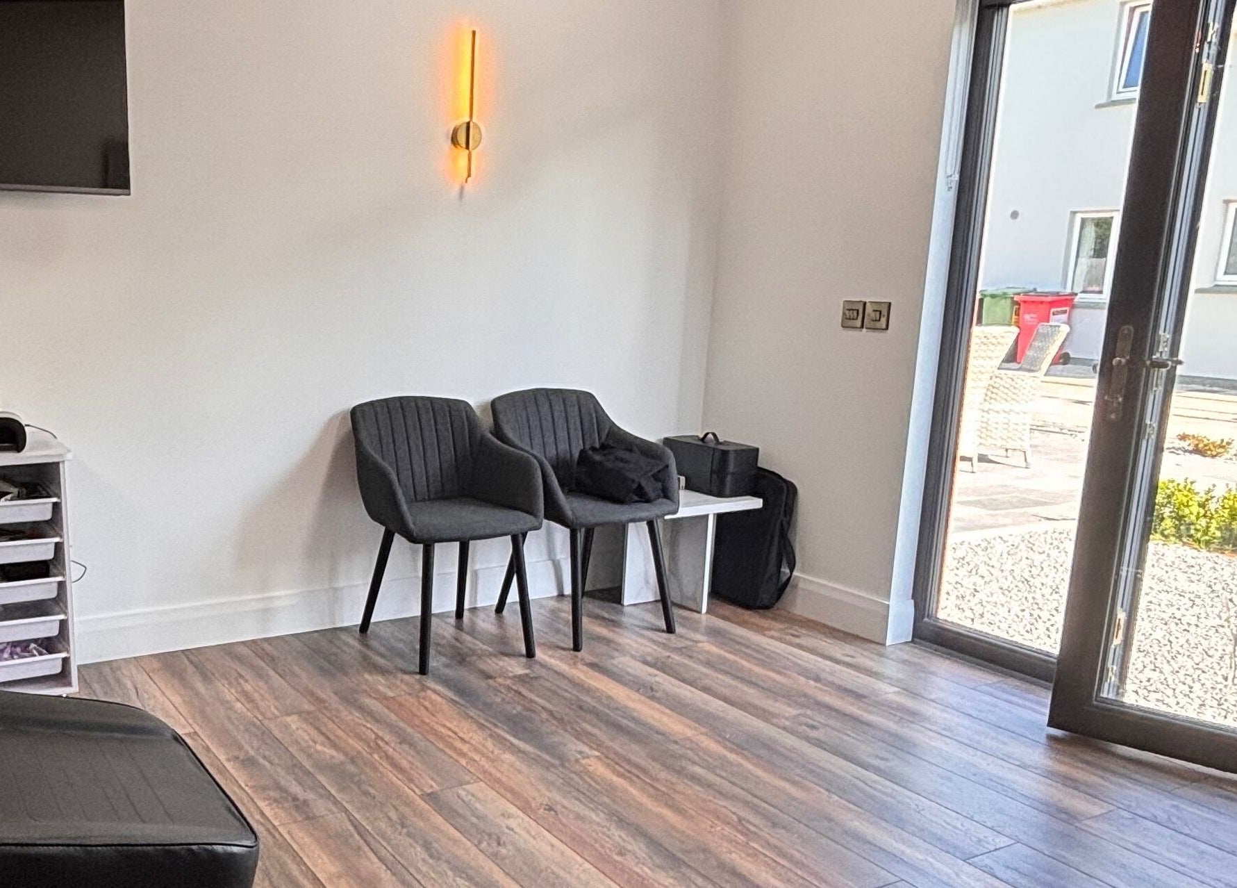 Relaxing waiting area at Beauty by Sarah Sheahan, County Cork, County Cork, IE, with chairs and modern decor.