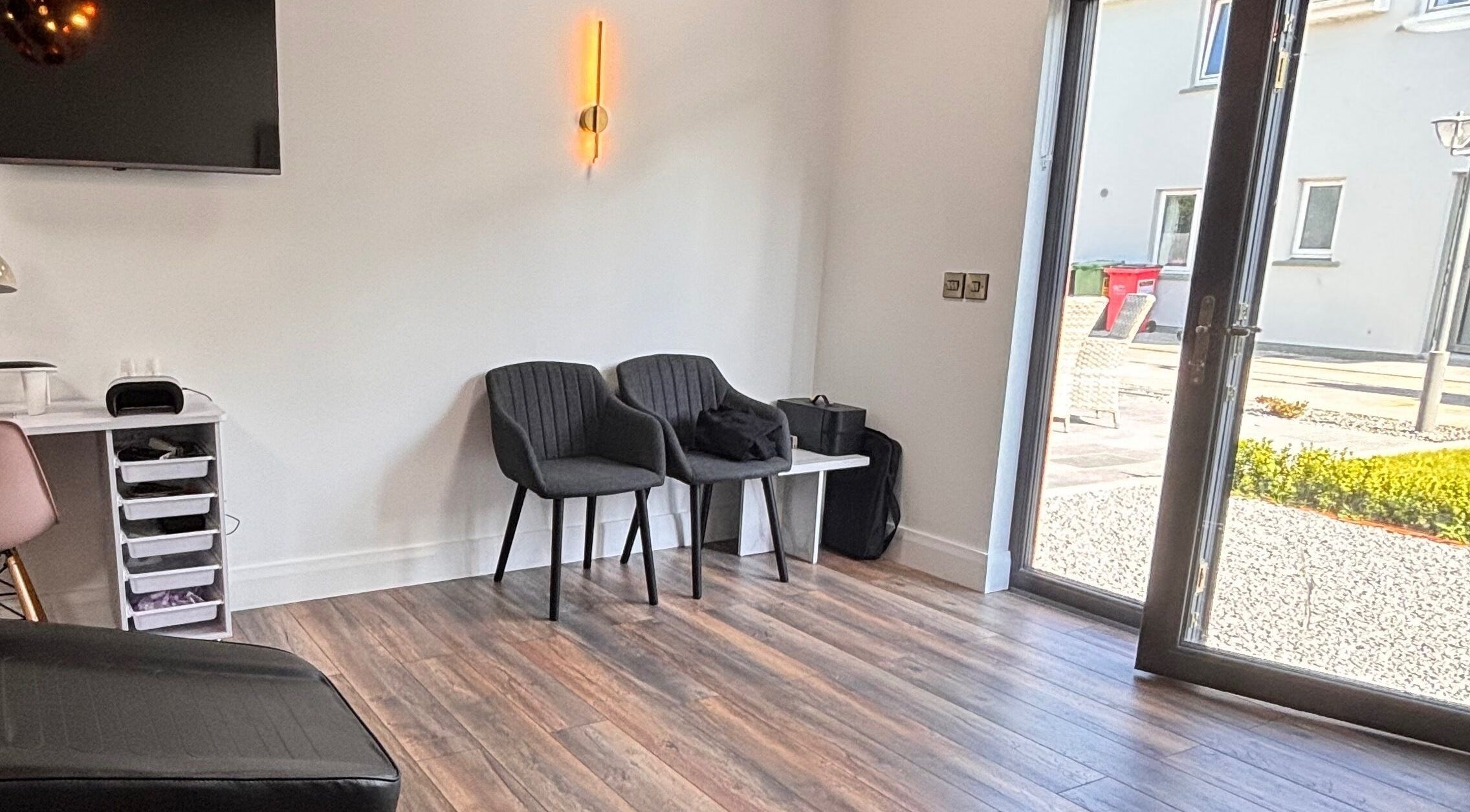 Relaxing waiting area at Beauty by Sarah Sheahan, County Cork, County Cork, IE, with chairs and modern decor.