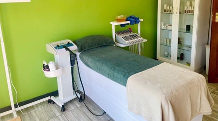 Relaxing treatment room at Mirabella Aesthetics Health & Beauty Clinic, Pretoria, Gauteng, ZA, with massage bed.
