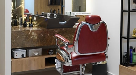 Vintage barber chair at Dax and Wax (Barbershop & Spa), Muscat, Muscat Governorate, OM, complementing modern decor.