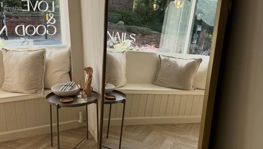 Inviting seating area at Doctor Cliona, Ripon, England, GB. Features soft cushions and a chic side table.