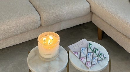 Inviting candle-lit table at Doctor Cliona in Ripon, England, GB, offering serene relaxation.