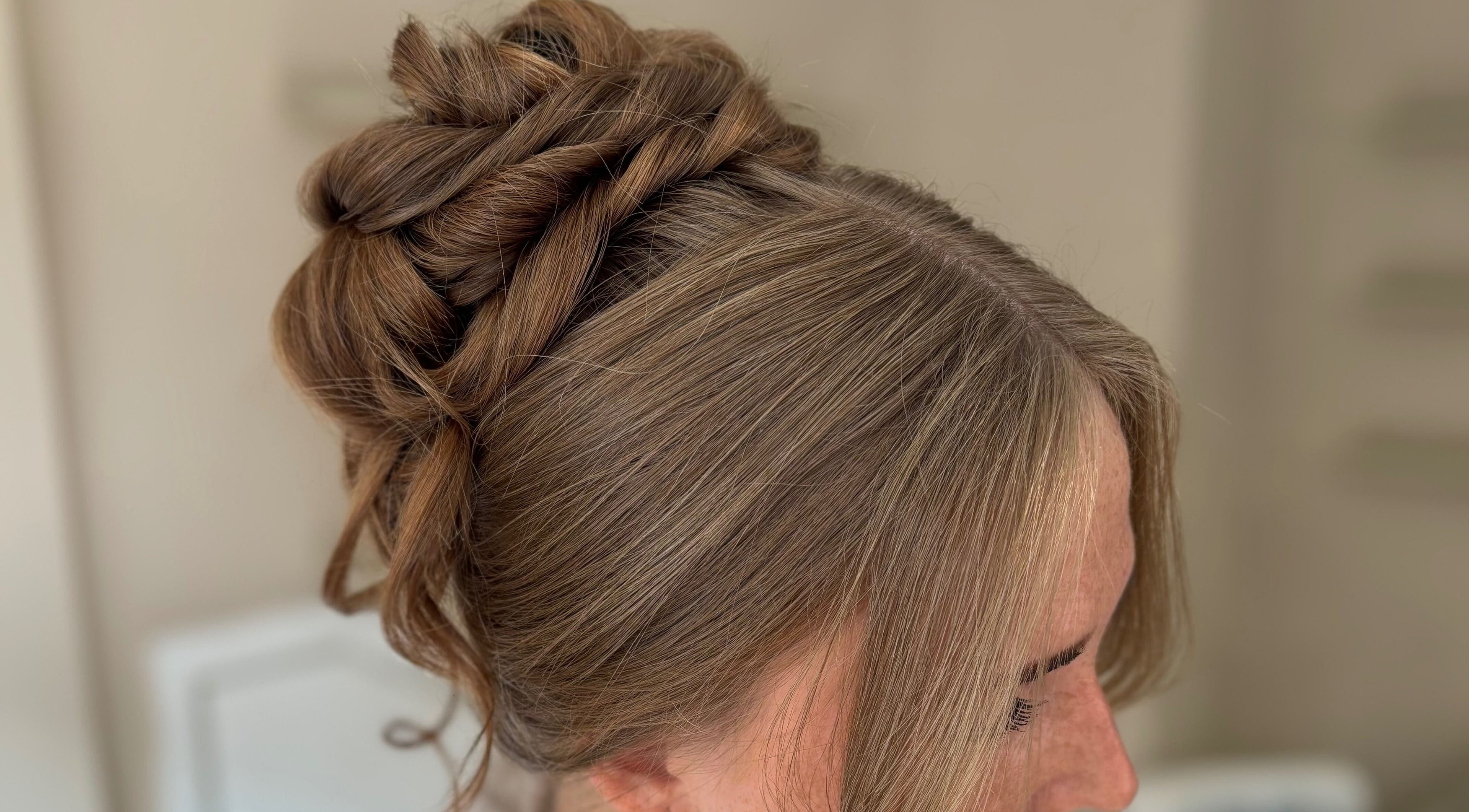 Stylish brown braided updo at CW Hair Extensions, Newcastle upon Tyne, England, GB.