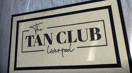 Welcome mat with 'The Tan Club Liverpool' logo at Liverpool, England, GB venue entrance.