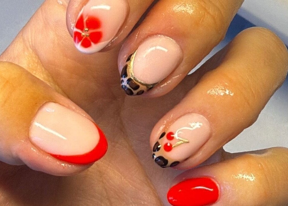 Bright and creative nail art at Beauty by Soph, Wickford, England, GB, showcasing flower and animal print designs.