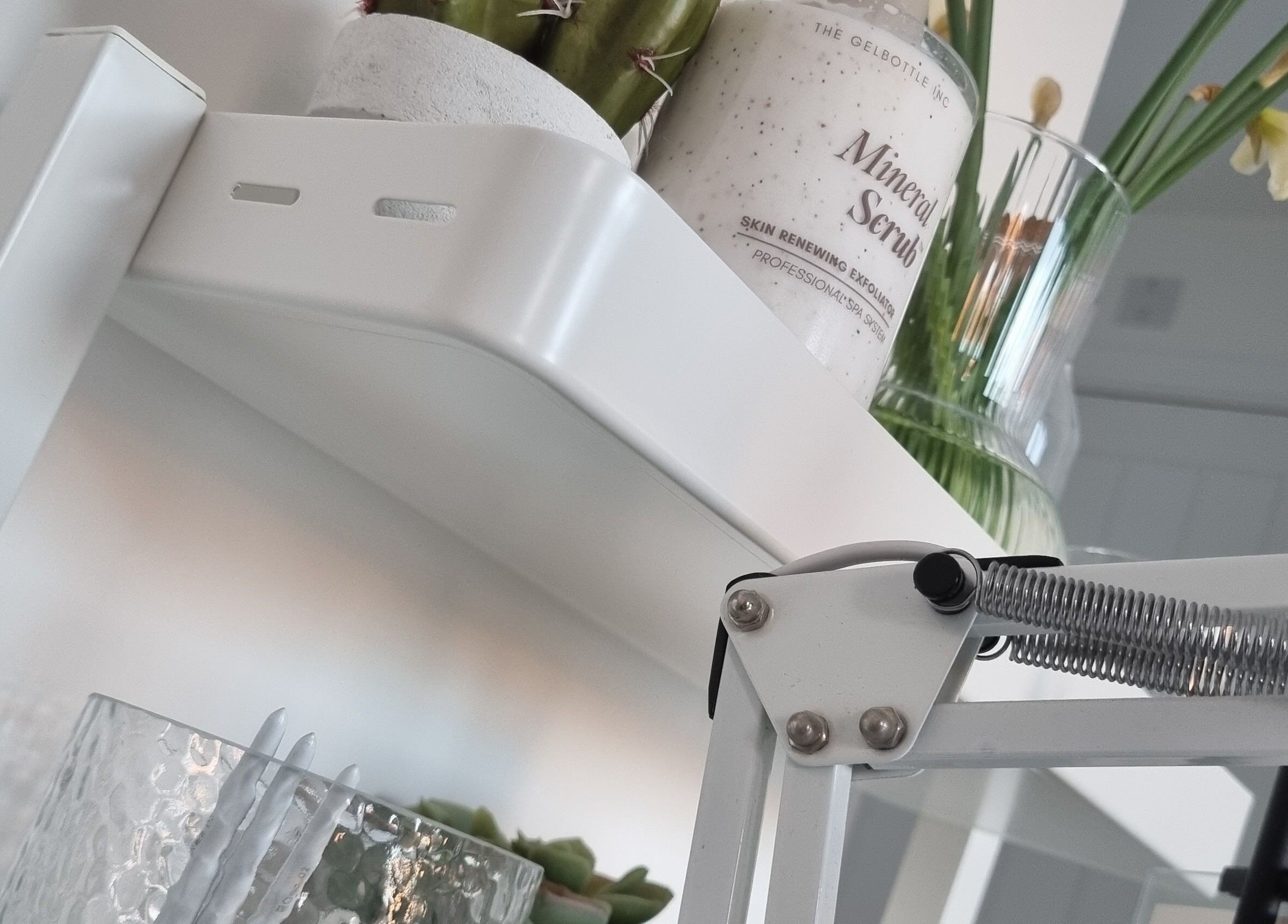 Mineral scrub on a white shelf with decor at Bare Nails, Westergate, England, GB.