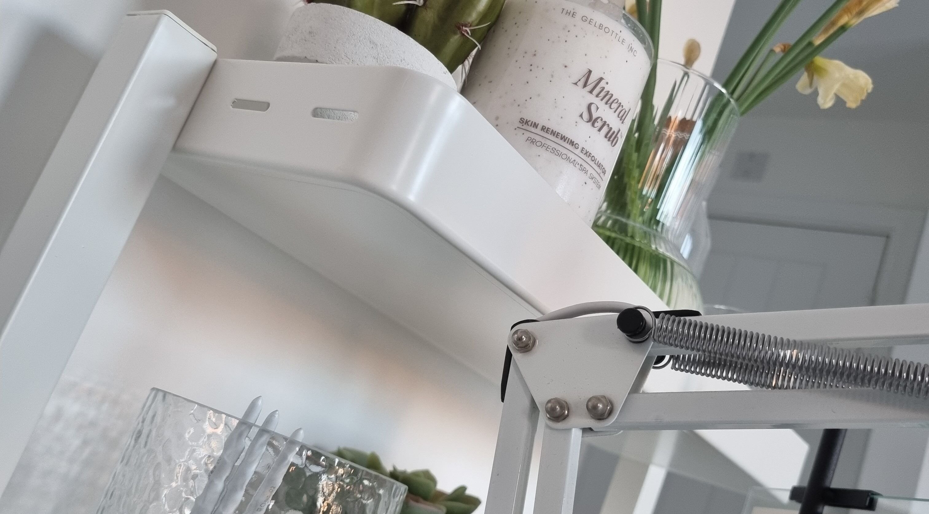 Mineral scrub on a white shelf with decor at Bare Nails, Westergate, England, GB.