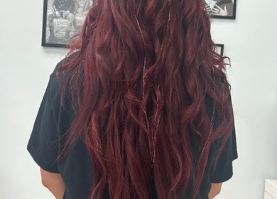 Crimson waves hairstyle at High Priestess Hair in St. Catharines, Ontario, CA, showcasing vibrant color and texture.