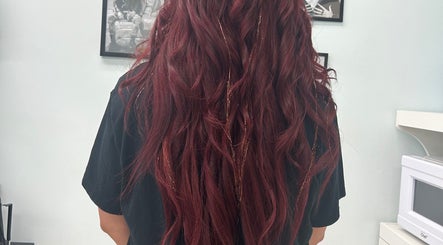 Crimson waves hairstyle at High Priestess Hair in St. Catharines, Ontario, CA, showcasing vibrant color and texture.