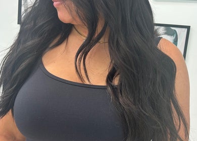 Long dark hair styled in soft waves at High Priestess Hair, St. Catharines, Ontario, CA.