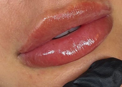 Close-up of glossy lips at Attvara Aesthetics in Great Kingshill, England, GB.