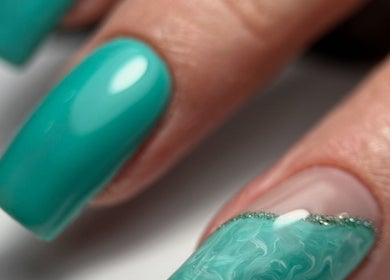 Turquoise nails with artistic design at F I A Nails, Beauty and Wellness, Diss, England, GB.