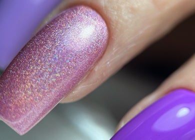 Close-up of shimmering pink and purple nails at F I A Nails, Beauty and Wellness, Diss, England, GB.