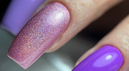 Close-up of shimmering pink and purple nails at F I A Nails, Beauty and Wellness, Diss, England, GB.