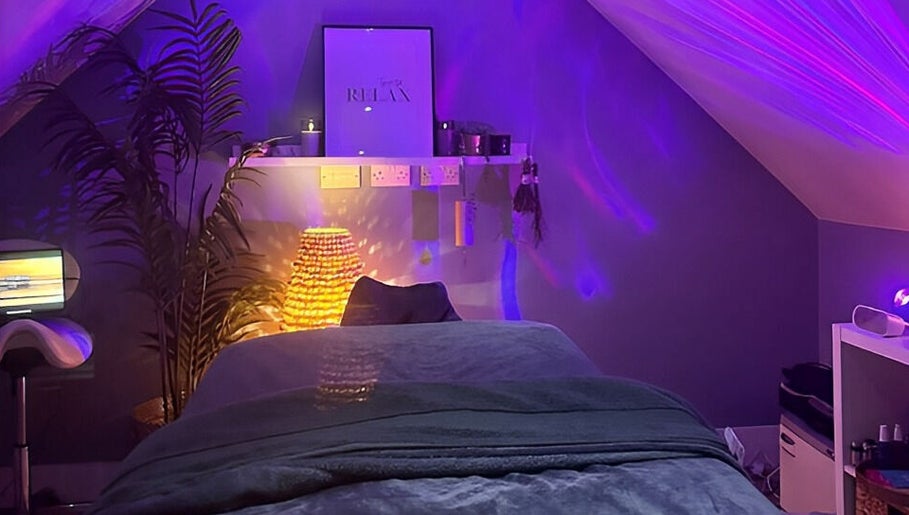 Relaxing massage room at Be Well Massage & Holistic Therapies in Gleno, Northern Ireland, GB with soft lighting.