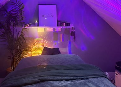 Relaxing massage room at Be Well Massage & Holistic Therapies in Gleno, Northern Ireland, GB with soft lighting.