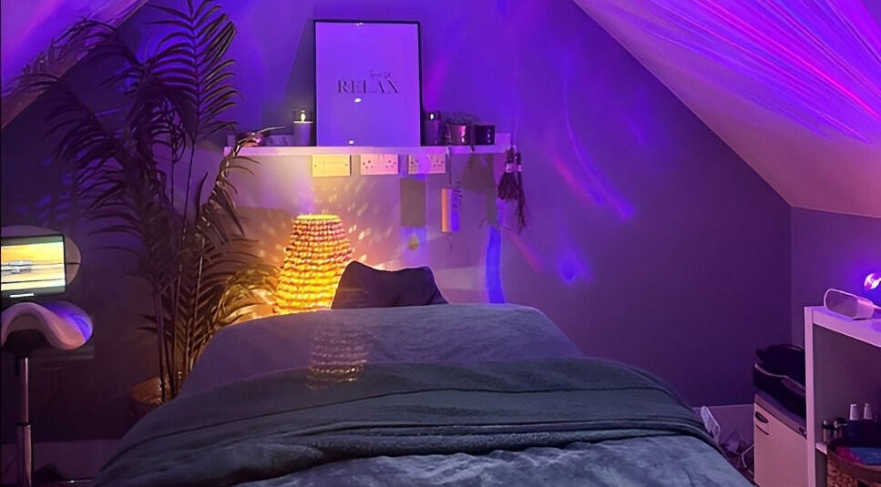 Relaxing massage room at Be Well Massage & Holistic Therapies in Gleno, Northern Ireland, GB with soft lighting.