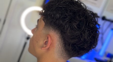 Men's fresh curly haircut at Kasboi Cuts in West End, Queensland, AU highlighting a stylish fade.