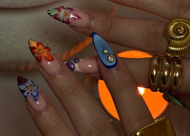 Elegant floral nail art with gold accents at Gemi Nailz, Cleveland, Queensland, AU.
