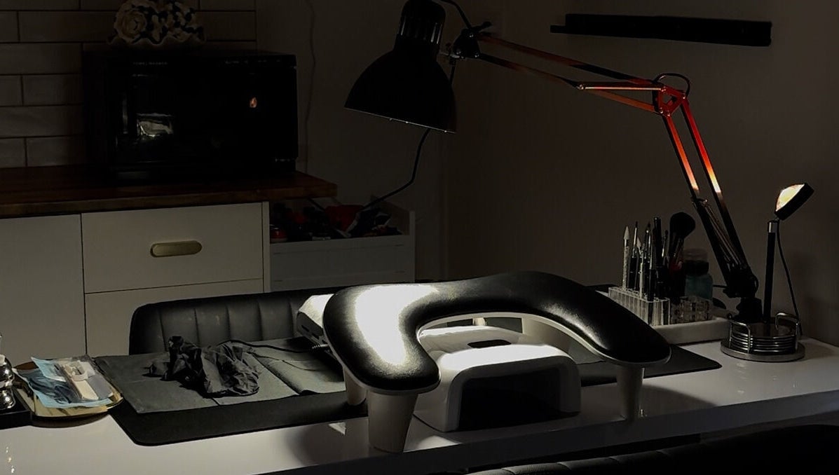 Inviting nail care setup at Gemi Nailz, Cleveland, Queensland, AU, featuring tools and modern lighting.