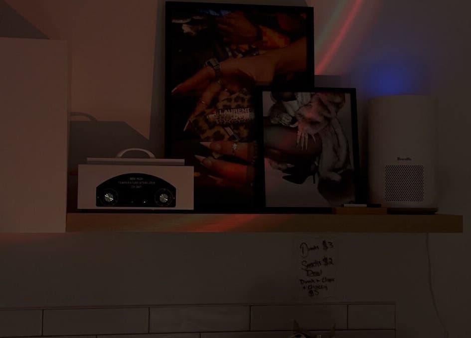 Stylish nail art display on a shelf at Gemi Nailz, showcasing elegance in Cleveland, Queensland, AU.