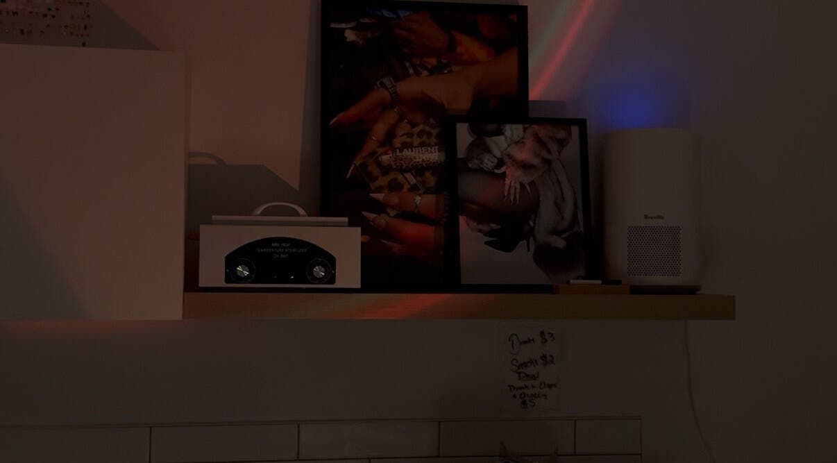 Stylish nail art display on a shelf at Gemi Nailz, showcasing elegance in Cleveland, Queensland, AU.