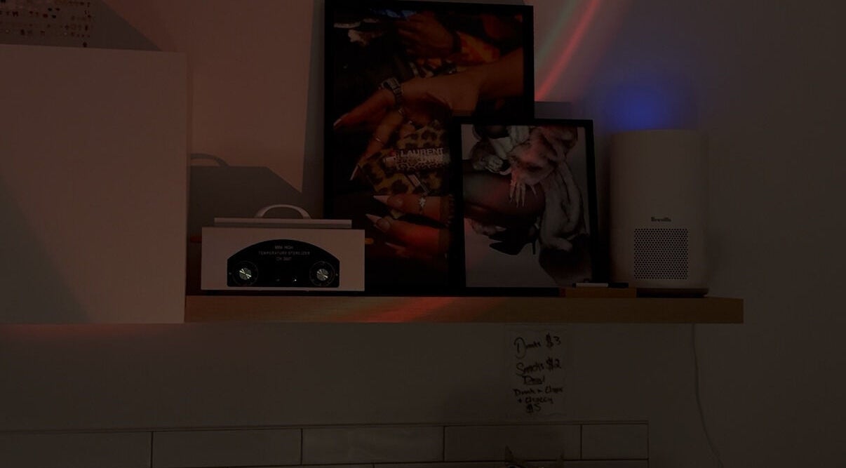 Stylish nail art display on a shelf at Gemi Nailz, showcasing elegance in Cleveland, Queensland, AU.