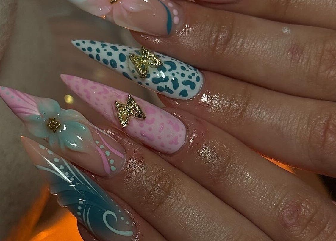 Elegant nail art with floral and leopard designs at Gemi Nailz, Cleveland, Queensland, AU.