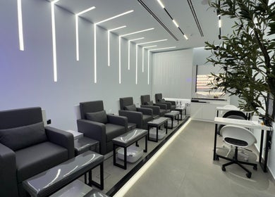 Modern lounge area at Beauty Room Salon and Spa | Al Khwaneej, Dubai, Dubai, AE with sleek chairs and decor.