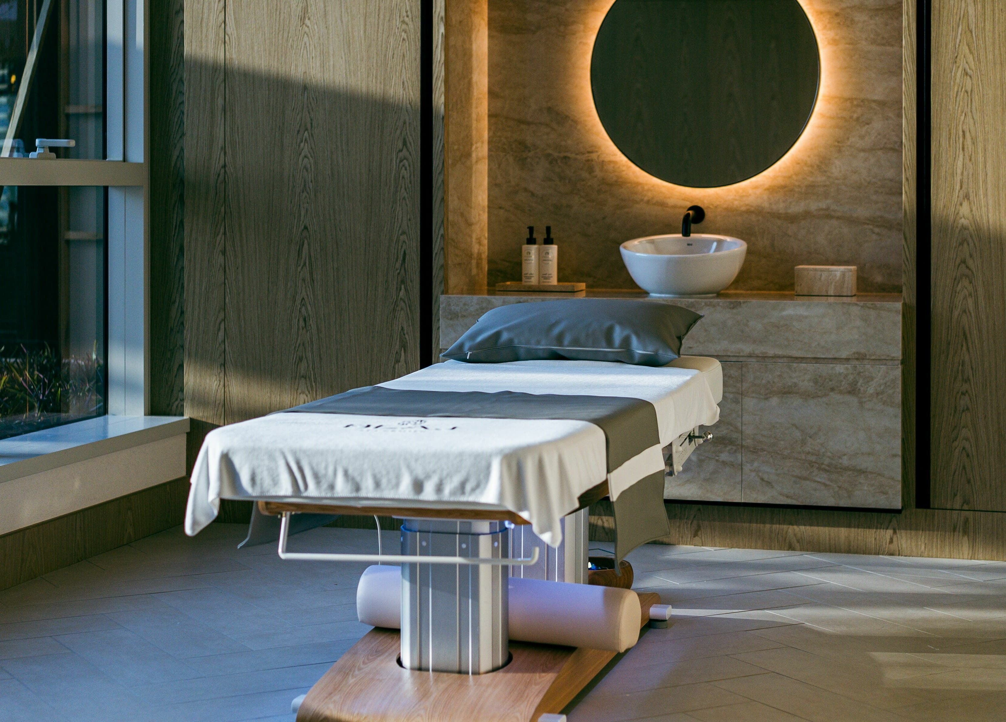 Luxurious spa room at Blaj Spa, Dubai, AE featuring a massage table and ambient lighting.