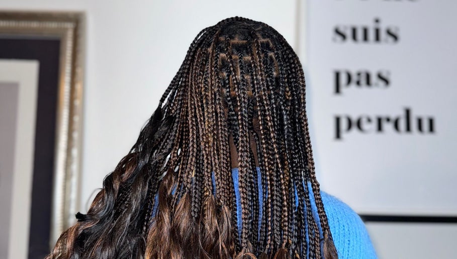 Intricate braiding style at Ennie's Braids LTD in London, England, GB. Showcasing vibrant, detailed work.