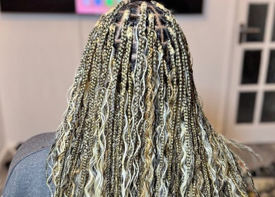 Intricate braids at Ennie's Braids LTD in London, England, GB, showcasing expert styling and texture.