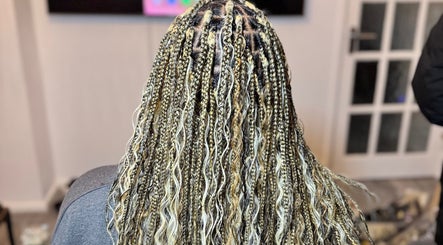 Intricate braids at Ennie's Braids LTD in London, England, GB, showcasing expert styling and texture.
