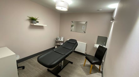 Elegant treatment room at Mind & Body Studio, Kirkcaldy, Scotland, GB with massage table and modern decor.
