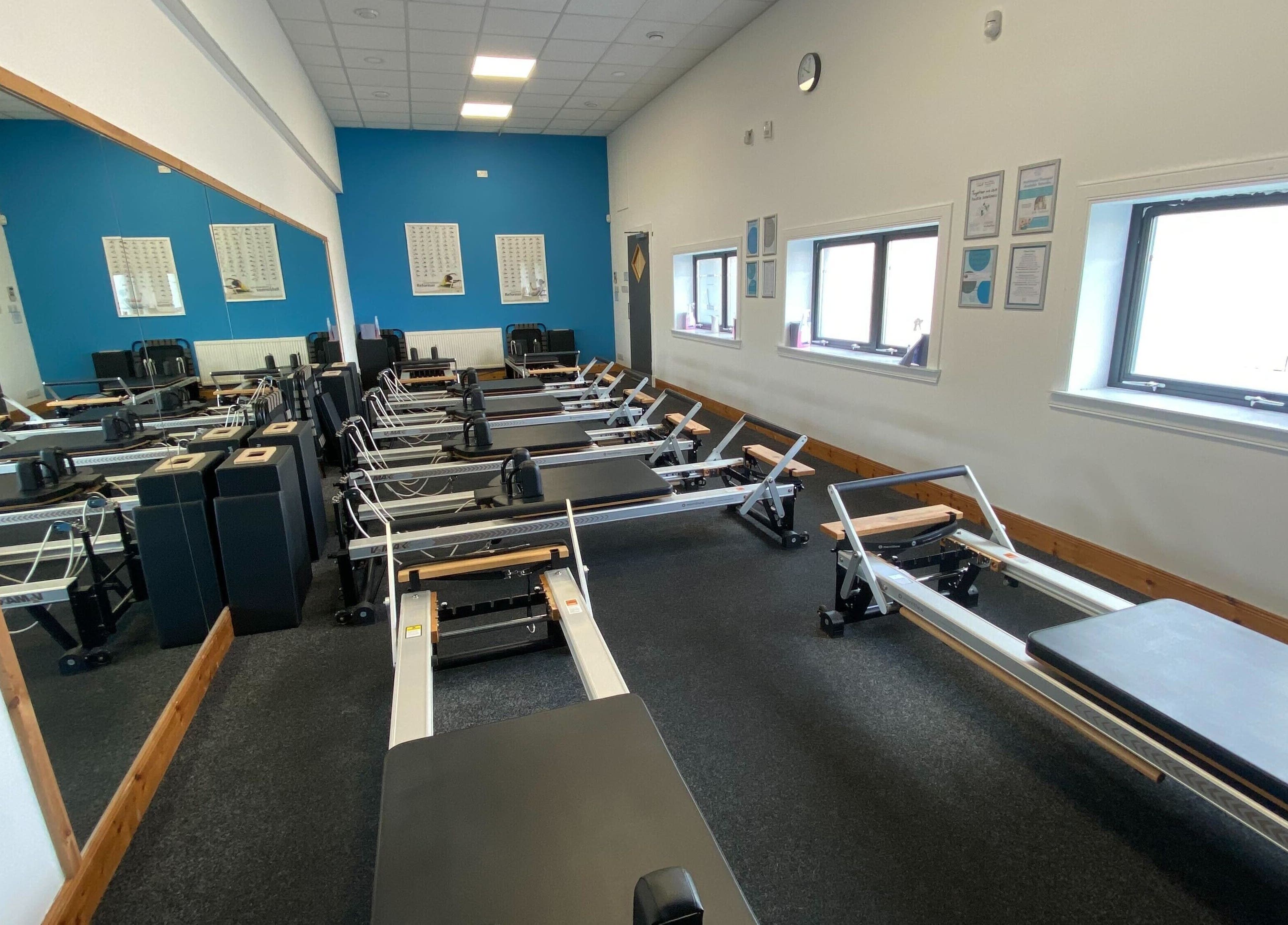 Pilates reformer machines lined up at Mind & Body Studio, Kirkcaldy, Scotland, GB.