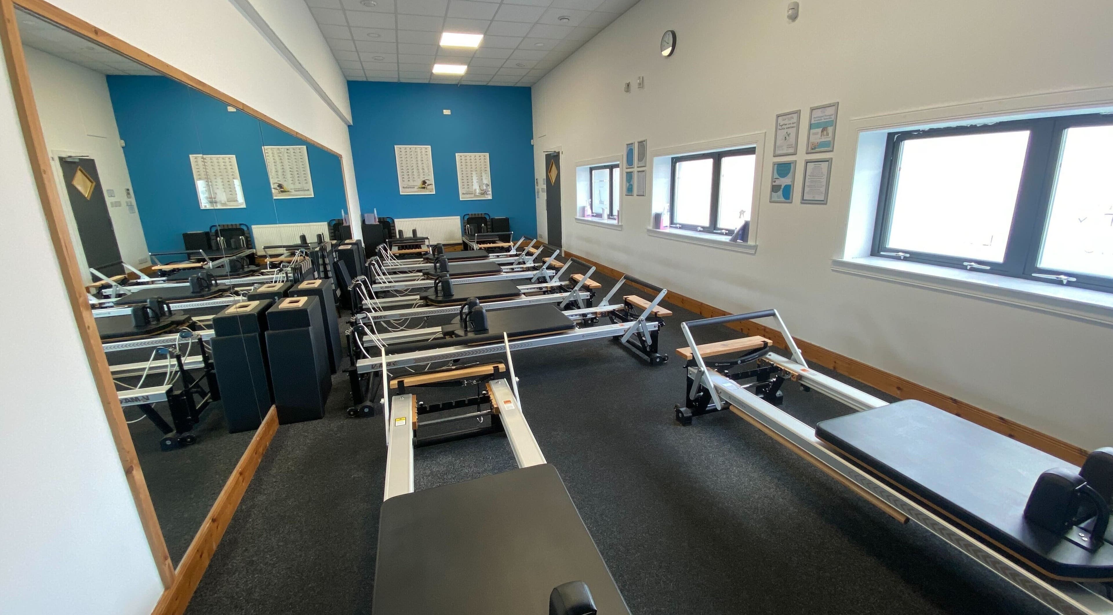 Pilates reformer machines lined up at Mind & Body Studio, Kirkcaldy, Scotland, GB.
