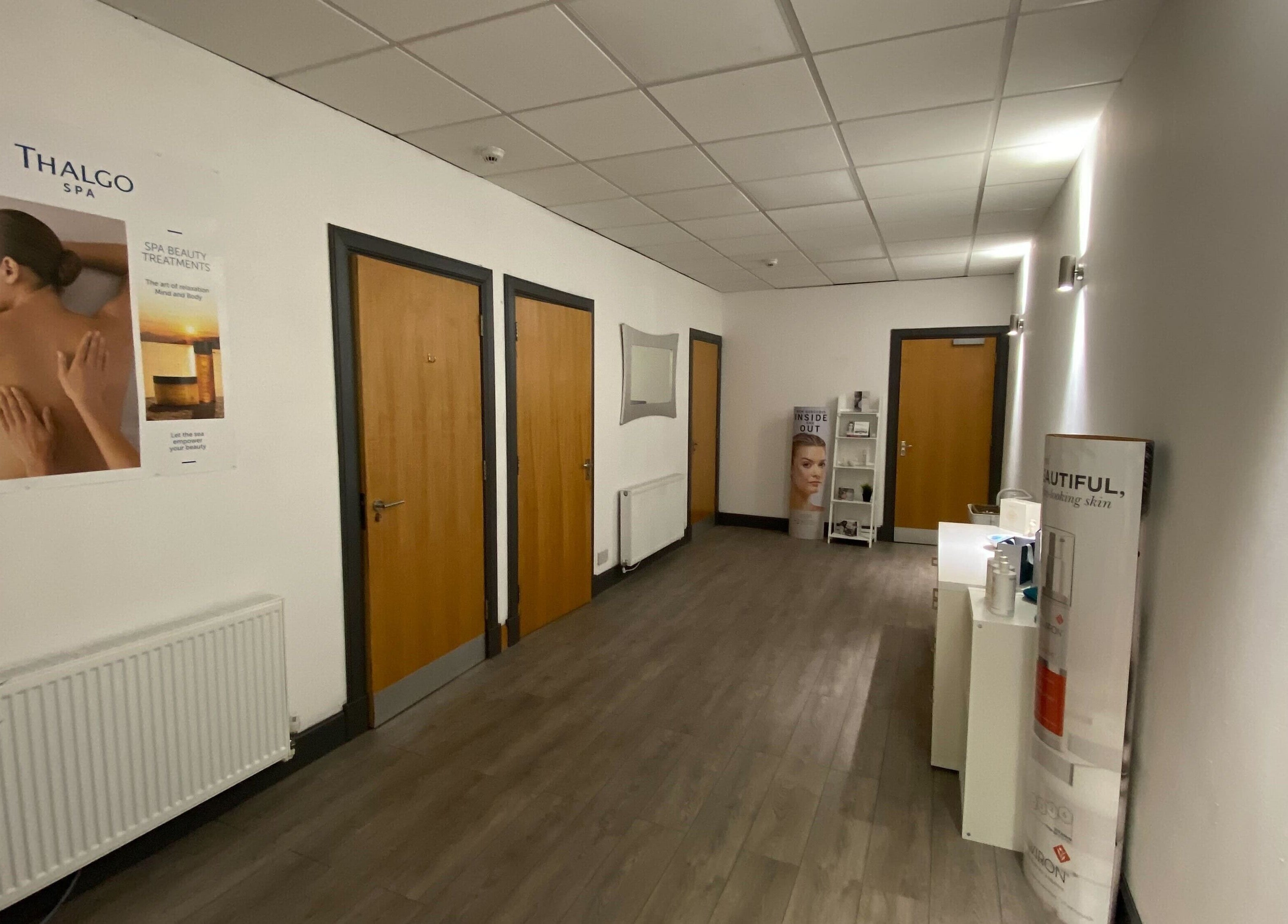 Tranquil hallway at Mind & Body Studio, Kirkcaldy, Scotland, GB with wellness posters and a soothing ambiance.
